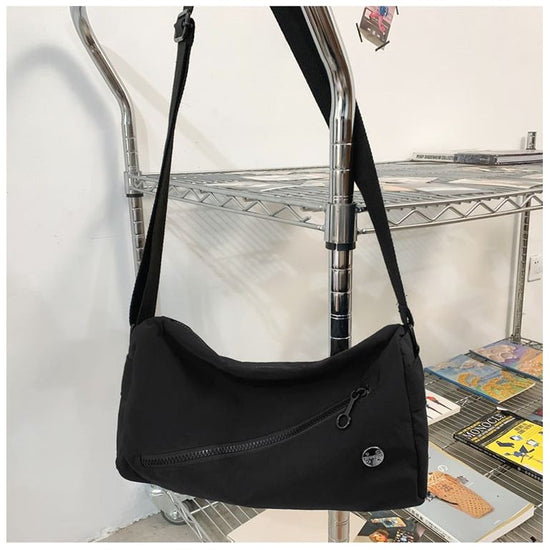An elegant black shoulder bag for travel and work
