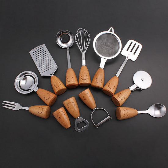 Kitchen Utensil Set - 12 Piece - Includes a peeler, egg separator, spoon, fork, pizza cutter, bottle opener, spatula, slotted spoon, grater, soup ladle, whisk and toothpick holder - The perfect gift for a housewife.