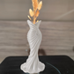 This elegant dress vase combines high-fashion elegance with minimalist home décor. Whether you insert real flowers into the glass tube or display artificial flowers without the tube, it is exceptionally beautiful.