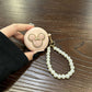 Pink headphone cover + hook AirPods 3