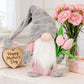 1pc Plush standing gnome doll — faceless old man figurine, festive tabletop ornament and gift.Gray faceless old man gnome holding a bouquet