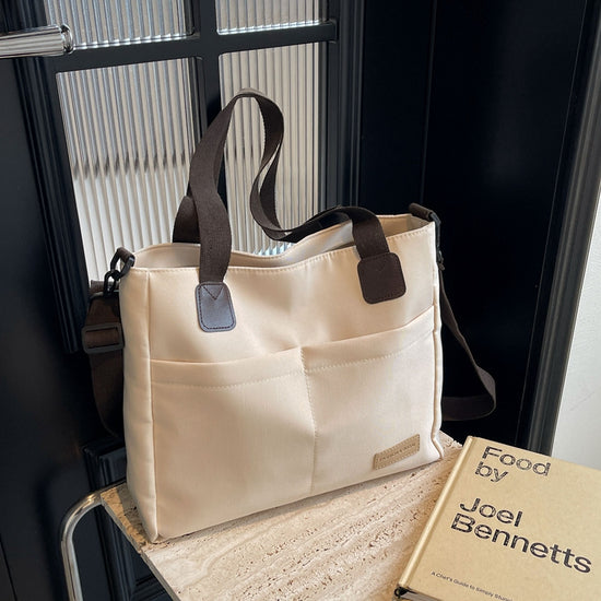 Stylish white canvas tote bag with detachable shoulder strap