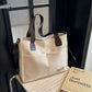 Stylish white canvas tote bag with detachable shoulder strap