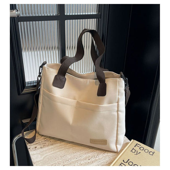 Stylish white canvas tote bag with detachable shoulder strap