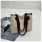 Stylish khaki canvas tote bag with detachable shoulder strap