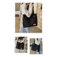 Stylish black canvas tote bag with detachable shoulder strap