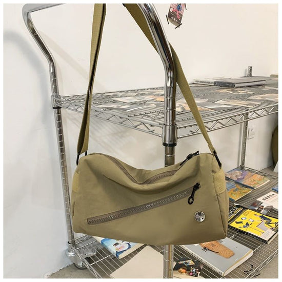 An elegant khaki shoulder bag for travel and work