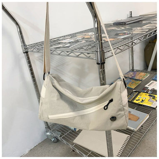 An elegant white shoulder bag for travel and work