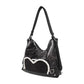 Stylish black tote backpack with heart embellishment - can be worn on one shoulder or as a backpack