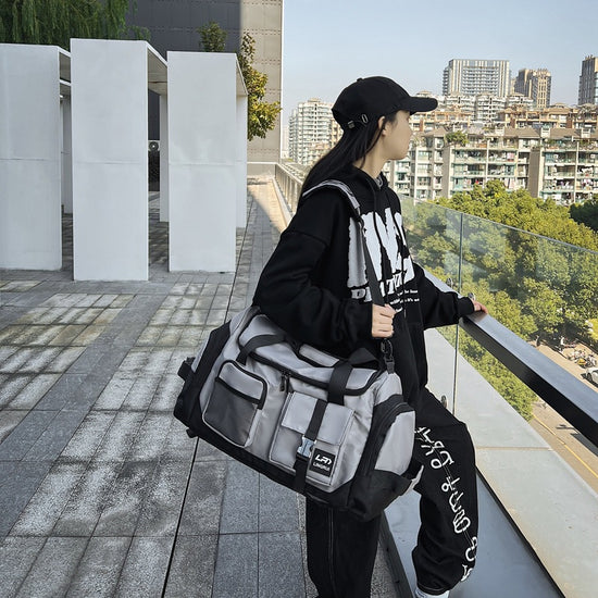 Grey Unisex Travel Bag with Utility Buckles and Wet/Dry Compartments