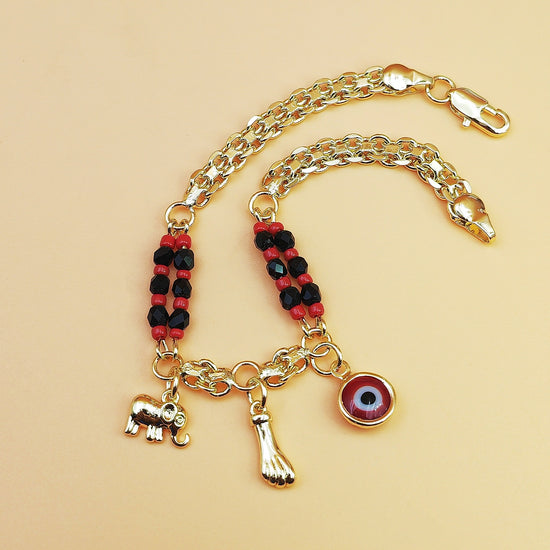 Gold-Tone Chain Bracelet with Red and Black Beads, Elephant Charm, Feather Pendant, and Round Stone Accent – 19 cm Length