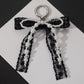 Korean Style Designer Faux Pearl and Fabric Bow Bag Charm Elegant Black Ribbon Bow Keychain for Handbags and Car Keys