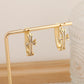 2-Pair Gold Sparkling Iced Out Rhinestone Cross Hoop Earrings - Punk Elegance Ear Buckle for Women