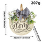 Rustic Wooden Door Hanger – "Bless This Home and All Who Enter" Round Sign with Artificial Flowers & Striped Bow for Front Door, Porch, or Entryway Decor